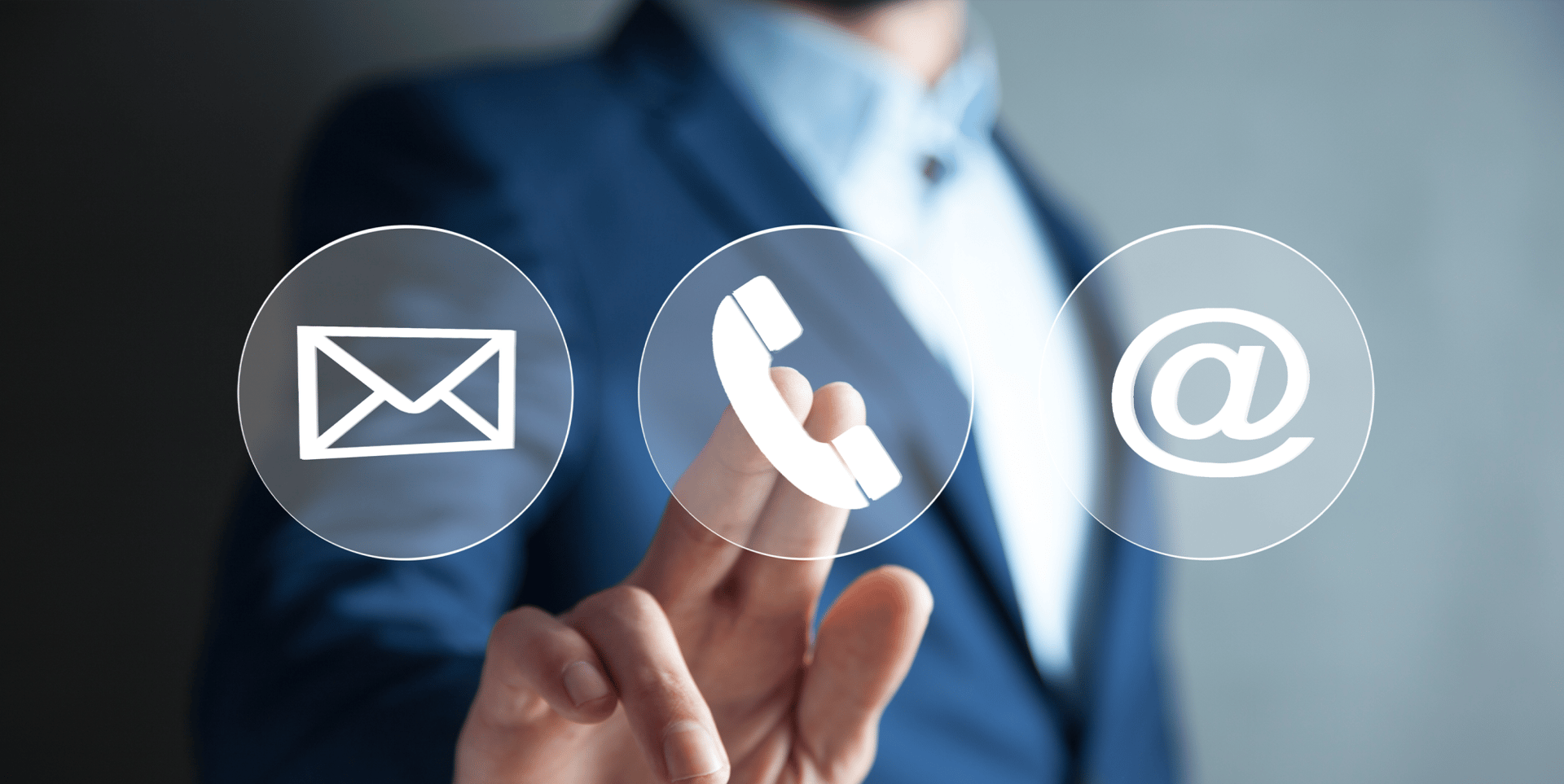 A person in a suit interacts with digital icons representing email, phone, and a contact symbol.