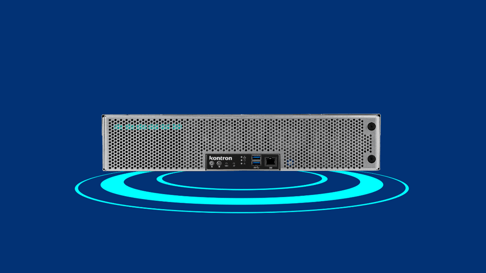 A sleek, silver server with a perforated front panel, featuring various ports including USB and network connections. The background is a solid blue with concentric circles radiating outward.