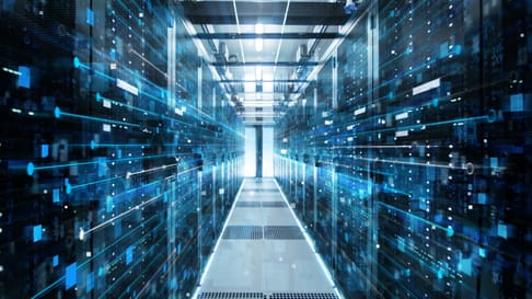 A futuristic data center corridor filled with glowing data streams, showcasing rows of server racks on both sides and a bright light at the end.