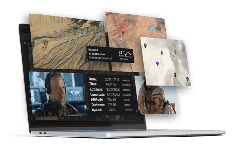 A laptop displaying a split-screen interface featuring military maps, weather conditions, and soldier coordinates. The top screen shows a terrain map with markers, while the bottom screen includes a video of a soldier and mission details such as date, time, and location information.
