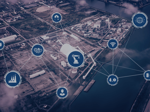 Aerial view of an industrial area featuring interconnected icons representing technology, manufacturing, and connectivity, illustrating a network of smart industry concepts.