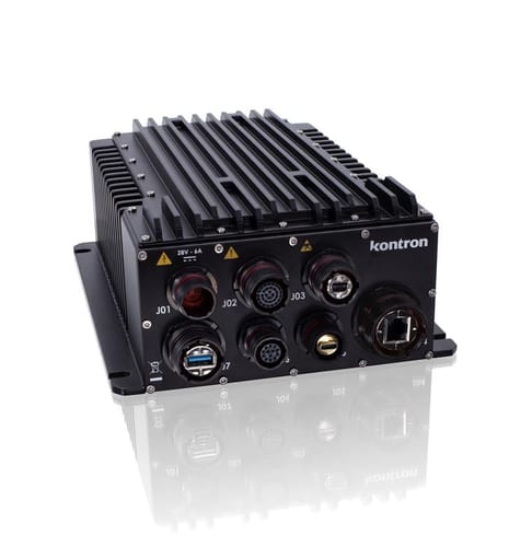 A black industrial computer chassis with multiple connectors on the front, featuring indicators for power and status. The design includes cooling fins on top for heat dissipation.